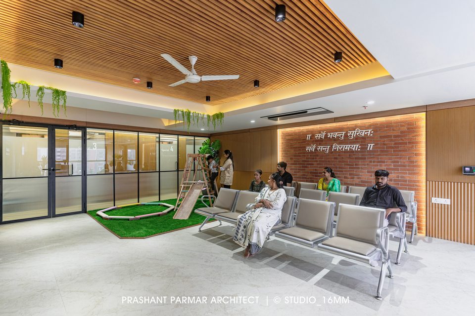 Hospital waiting area with seating and children’s play zone